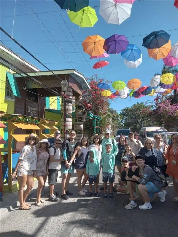 Group visiting a colorful Nassau neighborhood