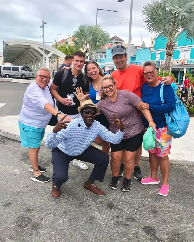 Tour group enjoying a colorful Nassau stop