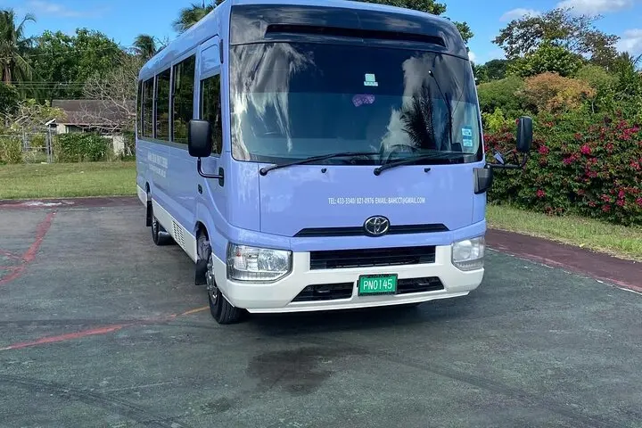 Toyota Coaster minibus used for group transportation in Nassau