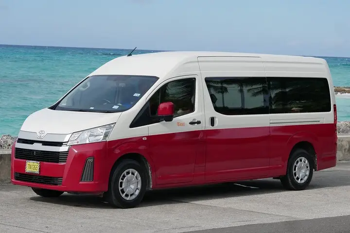 Sir Guillaume's red and white Toyota Hiace passenger van